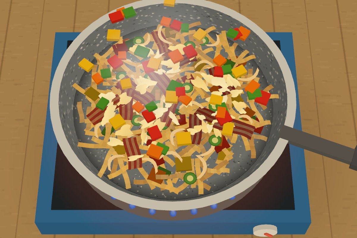The finished camp scramble in a nonstick pan on a one-burner stove
