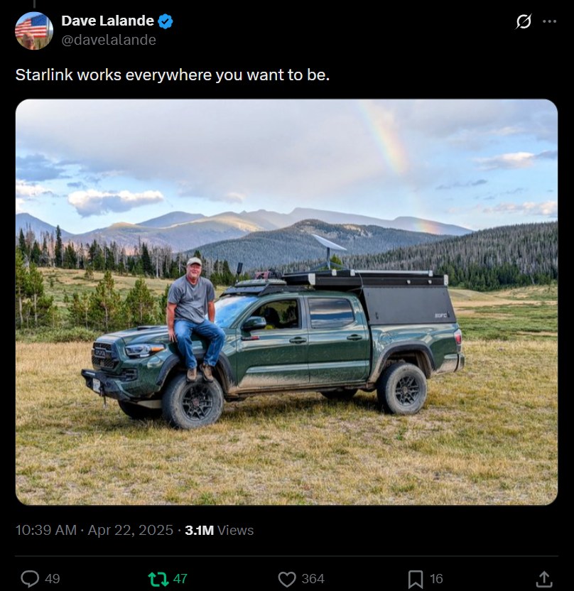 Dave Lalande's post on X: a photo of his green Toyota Tacoma with a Starlink dish on the camper roof, parked in a mountain meadow under a rainbow, captioned 'Starlink works everywhere you want to be.' The post shows 3.1M views.